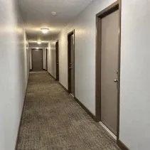 Apartment corridor painting Apartment corridor repainted light grey along the unit doors