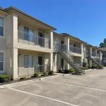 Apartment exterior repaint Apartment building exterior repainted beige with balconies in Kelowna