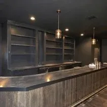 Bar area with dark painted walls and ceiling