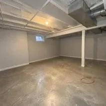 Finished basement in a Kelowna home painted light grey throughout