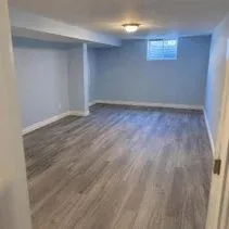 Basement rec room painted pale blue in a Kelowna home