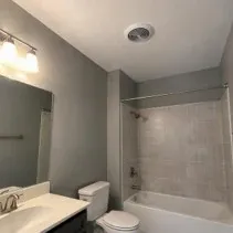 Bathroom wall and ceiling painting in grey Bathroom walls and ceiling freshly painted grey with mildew-resistant paint