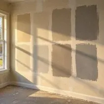 Large colour sample patches on drywall Large paint sample patches on bare drywall for comparing colours in daylight