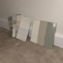 Paint colour swatch cards Colour swatch cards leaning against a finished baseboard
