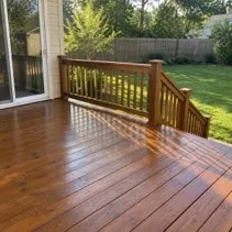Backyard wood deck freshly stained medium brown in Kelowna