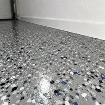 Garage epoxy flake texture Close-up of a garage epoxy floor showing the decorative flake texture