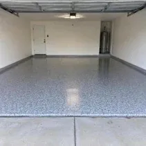 Residential garage floor coated in light grey epoxy in Kelowna