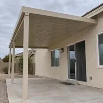 Aluminum patio cover painted beige to match the house