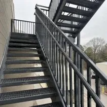 Industrial railing coating Industrial stairwell railing newly coated with a metal enamel