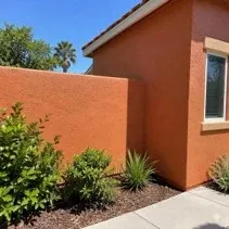 Terracotta stucco wall repaint Stucco garden wall repainted terracotta