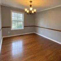Dining room repainted grey after wallpaper was stripped